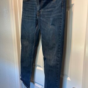 Levi's dark blue denim jeans with tan leather patch